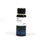 Oud Maison by Jana Premium 50ml unisex perfume bottle on a marble platform with Oud wood, Passionfruit, and Rose details.
